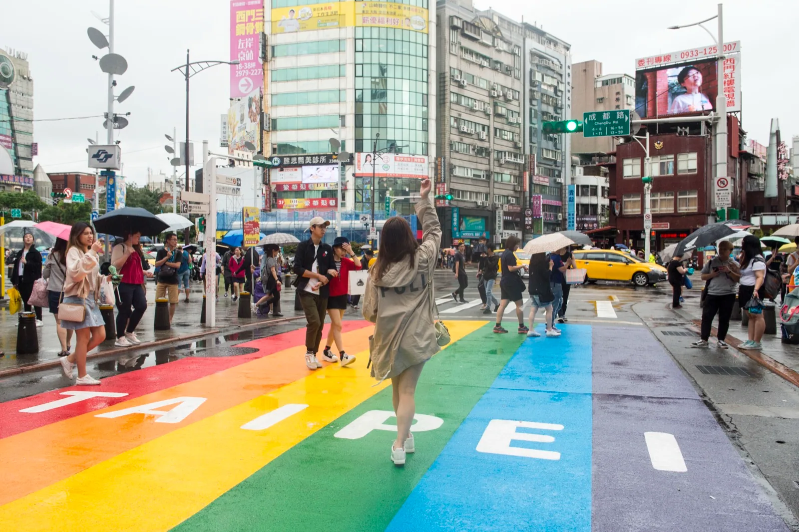 The Ximen pedestrian zone at six o’clock on a Saturday evening, as crowds cross the rainbow crosswalk toward the Red House: a symbol of Taipei youths’ open-air living room after the pedestrian zone was designated in the late 1990s
