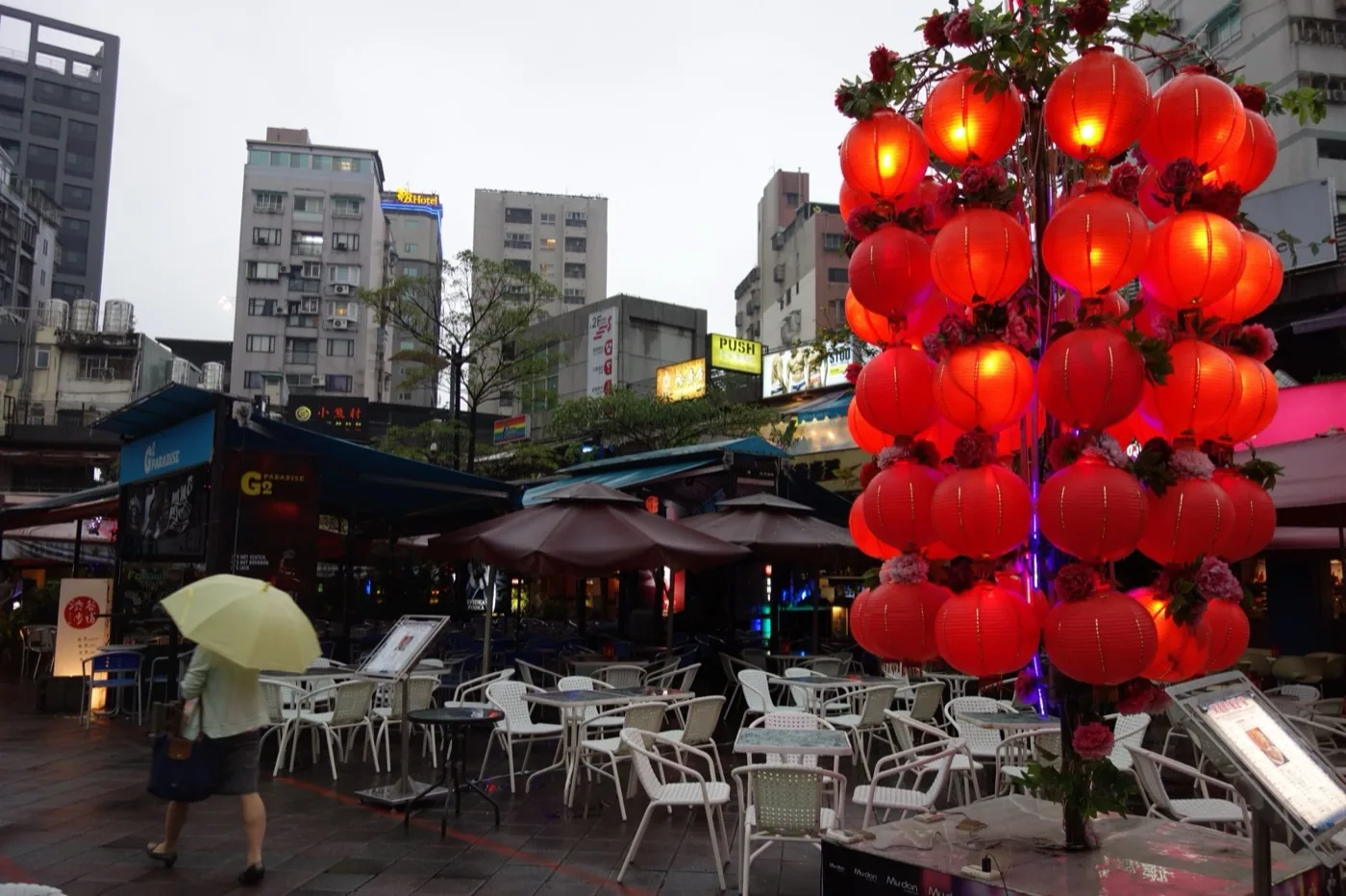 The Ximen Red House South Plaza, where the two red-brick buildings completed in 1908 — the octagonal hall to the north and the cruciform building to the south — became an outdoor bar district and LGBTQ-friendly public space in the twenty-first-century evening