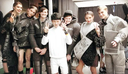 Huang Shan-liao (center, white shirt) backstage at the 2014 London Graduate Fashion Week, posing with models wearing his