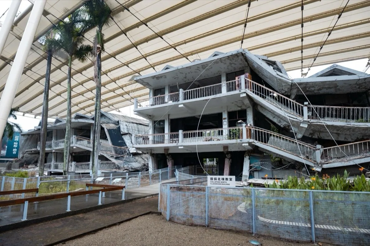 The preserved damaged classrooms of Guangfu Junior High School in Wufeng, Taichung, now part of the 921 Earthquake Museum, with fractured brick walls and exposed beams showing the destruction wrought by the earthquake.